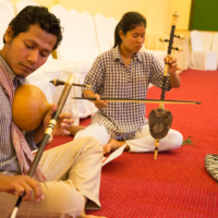 Ms. Ip Theary plays Roneat Ek, Khmer xylophone and Ms. Yim Chanthy plays Khloy, Khmer flute.
