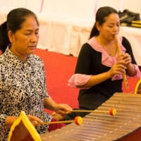 Mr. Nhok Sinat plays Ksa Diew, one-string with hollowed-out gourd instrument and Ms. Men Mao plays Tro Khmer, three-string fiddle.