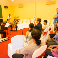 Performers, composers and students at rehearsal