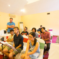 Composers and students are listening performance at rehearsal.